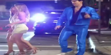 public dance performance video of a man dancing confidently in public as women laugh and record