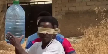 blindfolded prank game video with friends reacting to swinging bottle