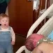 Toddler reactions to new baby as a shocked older sibling reacts emotionally to a newborn baby at home
